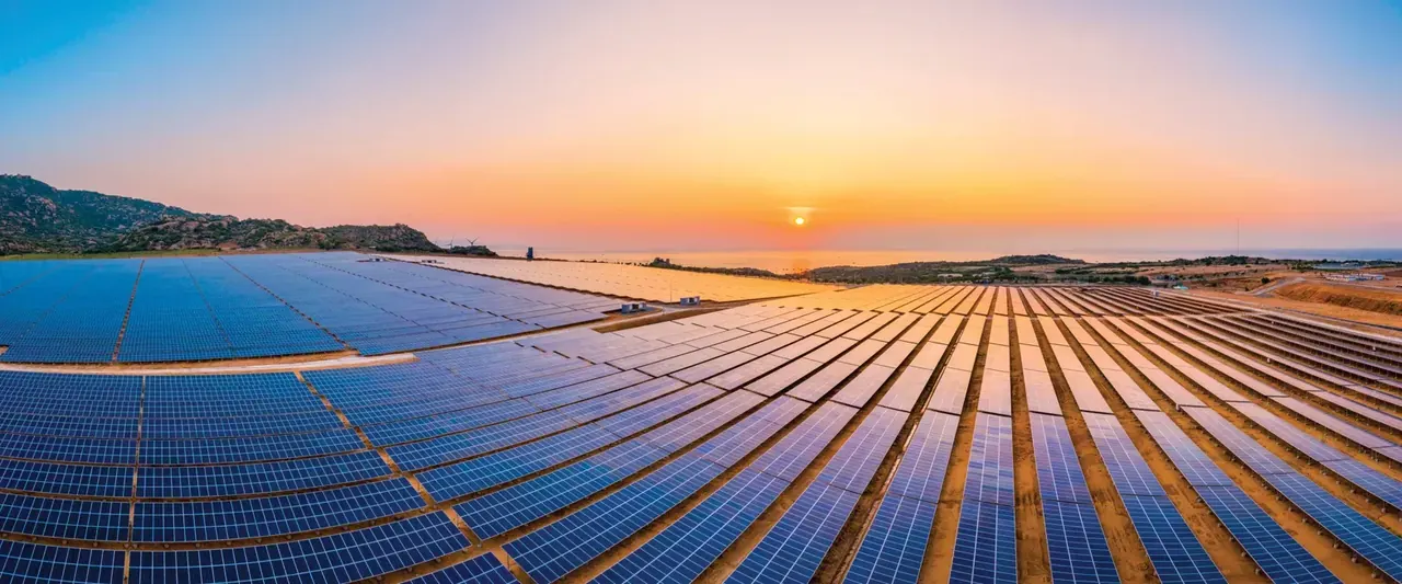 Solar power plant at sunset